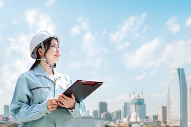 istock Construction workers against the backdrop of the city 1391158720