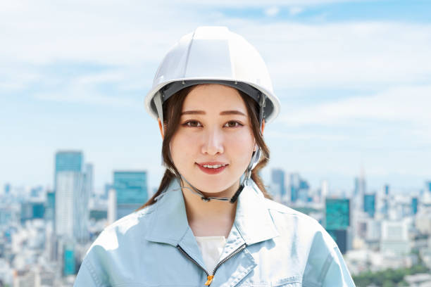 istock Construction workers against the backdrop of the city 1391158723
