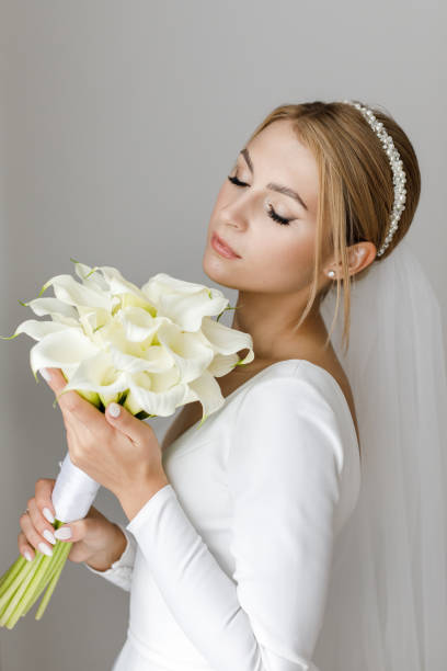 istock The bride is holding a bouquet in her hands 1391160436