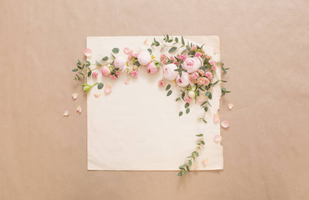 istock beautiful roses on background  old paper 1391160668