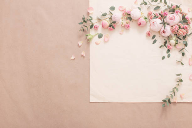 istock beautiful roses on background  old paper 1391160677
