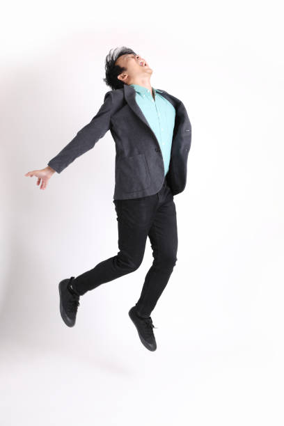 young asian businessman - men businessman jumping levitation imagens e fotografias de stock