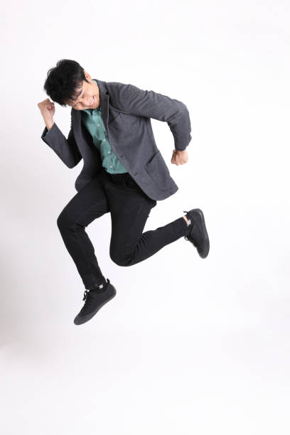 young asian businessman - men businessman jumping levitation imagens e fotografias de stock