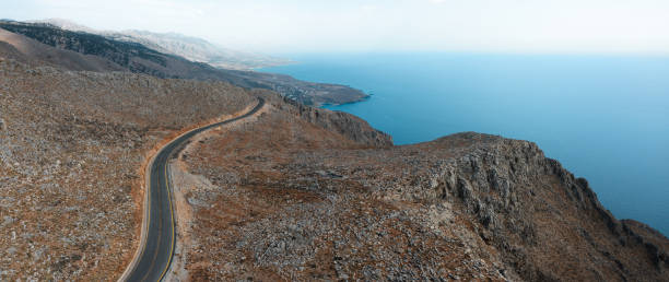 Aerial view on mountain road towards the sea in south Chania region (Crete, Greece).