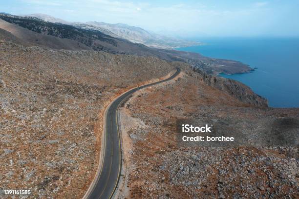 Road By The Sea In Crete Stock Photo - Download Image Now - Above, Aerial View, Asphalt