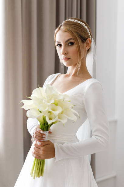 istock The bride is holding a bouquet in her hands 1391163257