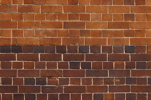 Brick wall of two different shades.