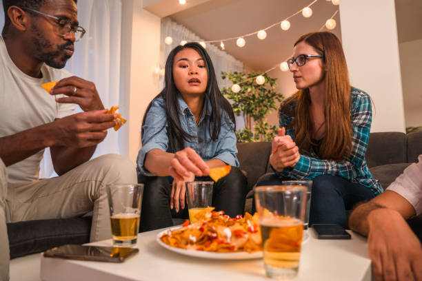 istock Diverse Friends Hanging Out Eating Snacks 1391166926