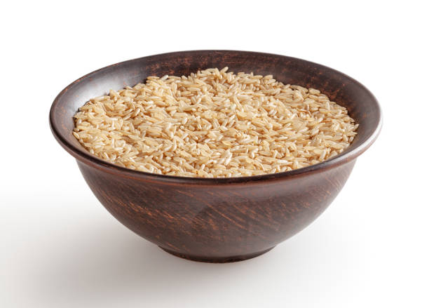 istock Brown rice in ceramic bowl isolated on white background with clipping path 1391167835