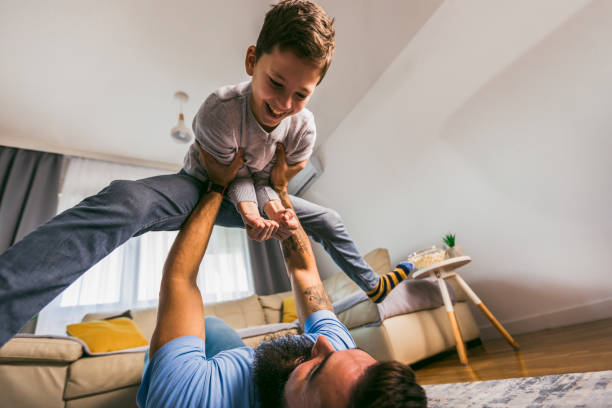 istock Father and son having fun at home. 1391167881