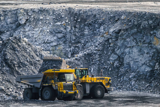 istock Loading stone with a wheel loader on a large truck. 1391169304