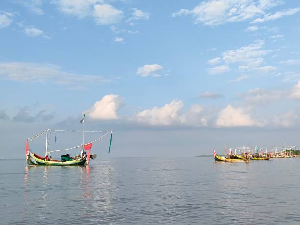 istock Fishing boat leaning on the seashore 1391169608