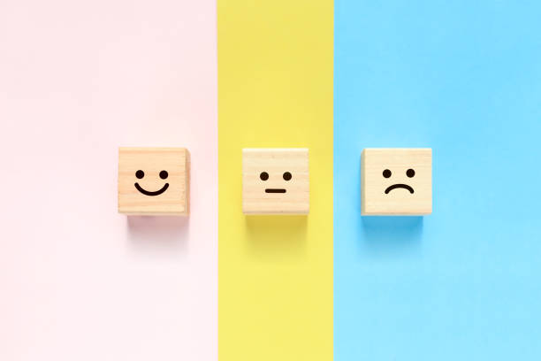 istock Building blocks with smile, normal face, and angry face. 1391170981
