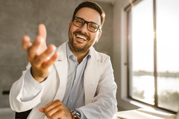 istock Happy medical expert having a video call from his office. 1391181262