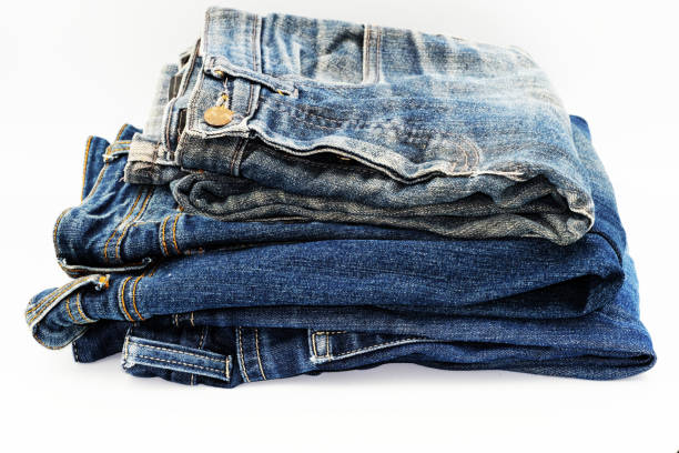 istock Blue jeans isolated on white background, jeans stacked 1391182472