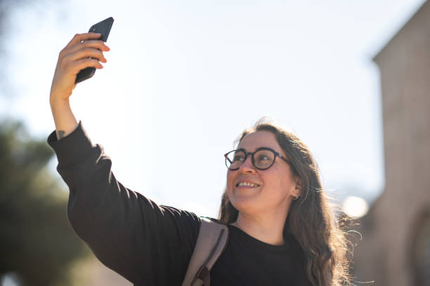 istock Woman taking selfie in sunlight 1391184869
