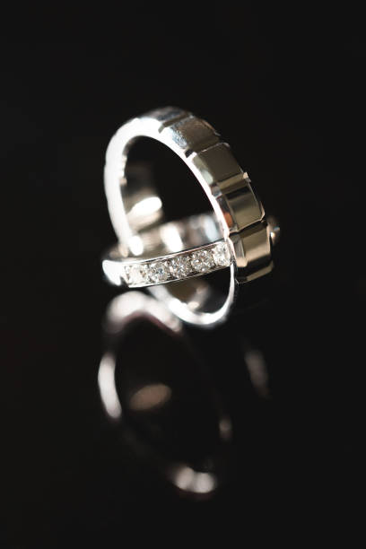 istock Two gold wedding rings close-up. Macro shooting 1391185605