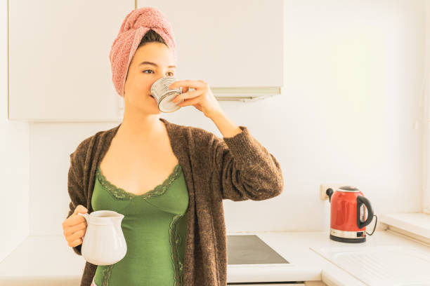 istock sip of aromatic coffee in morning on day off 1391185643