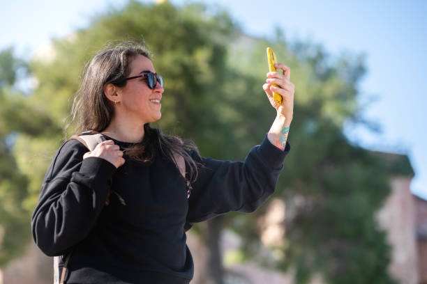 istock Woman taking selfie in sunlight 1391185691