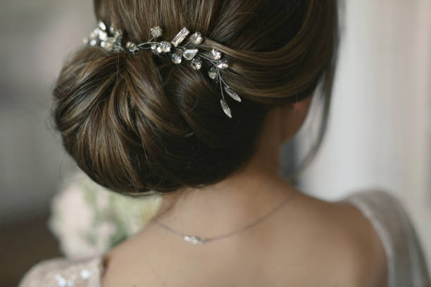 wedding hairstyle of the bride. rear view. - hairstyle imagens e fotografias de stock