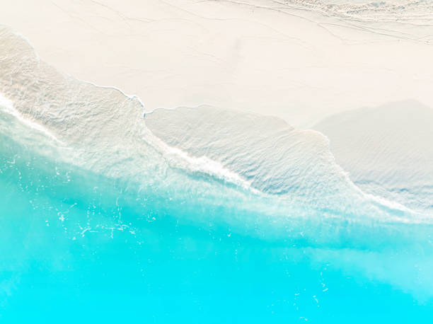 istock Summer tropical with Blue Ocean wave on a clean sandy beach background 1391188935
