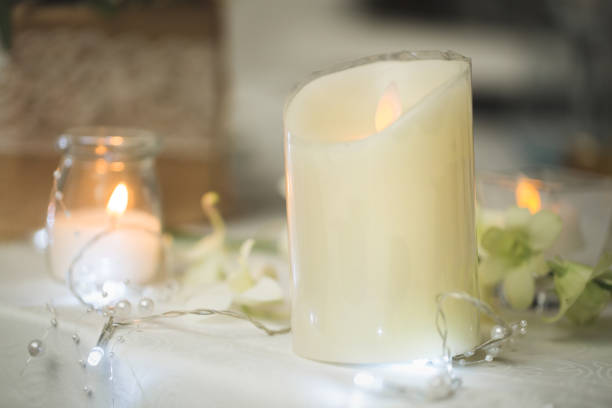 istock Candles on the wedding table. Delicate decor 1391190673