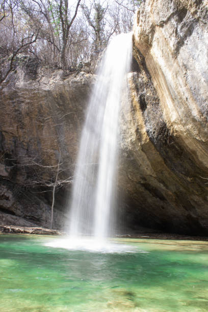 istock Waterfall Visor in Crimea in spring, waterfall, beautiful waterfall Visor in the Baydar valley of Crimea. Crimean waterfall visor. Vertical photo 1391190733