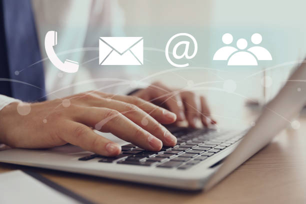 istock Hotline service. Man working on laptop at table, closeup 1391192417