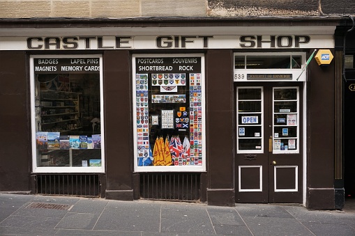 Edinburgh, Scotland - 8 April 2022: A tourist souvenir shop in Edinburgh's historic old town, near the castle, an area busy with tourists.