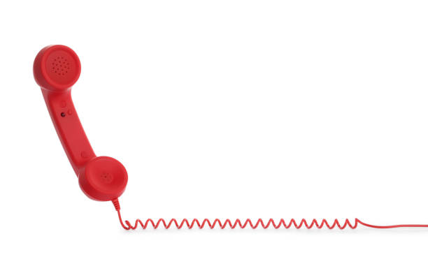 istock Red corded telephone handset on white background. Hotline concept 1391195389