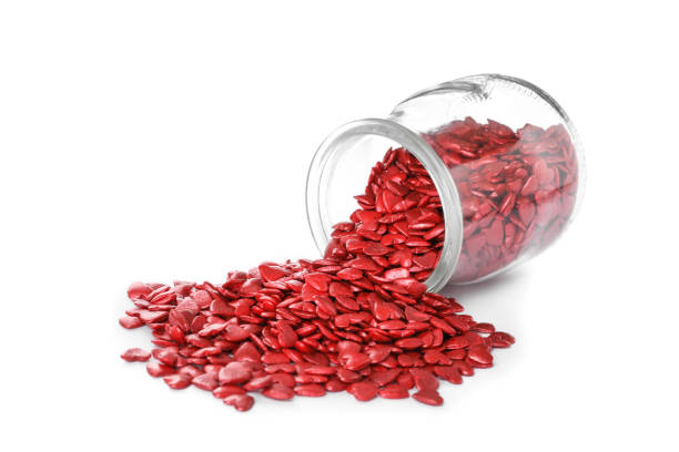 istock Jar and scattered candy hearts on white background 1391196158