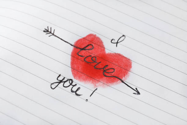 istock Text I Love You and red heart drawn on striped page 1391196302