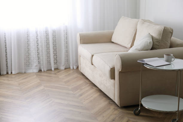 istock Parquet floor in room with sofa and coffee table 1391198317