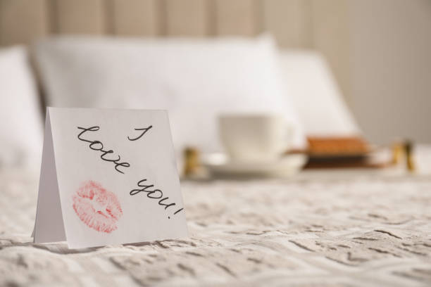 istock Romantic paper note I Love You on bed, closeup 1391198438