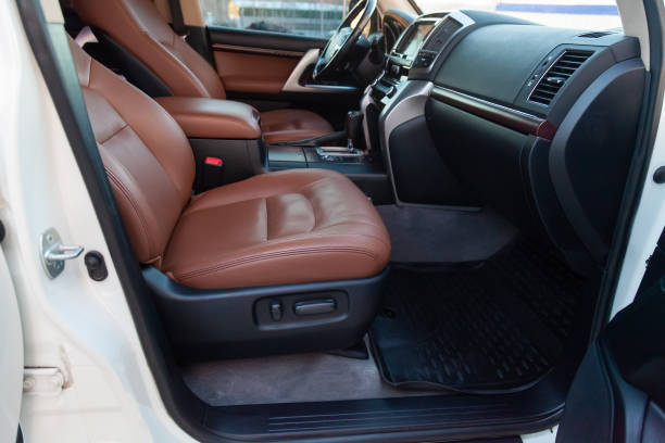istock Car inside front passenger place. Brown interior of prestige modern car. Front seats with steering wheel dashboard. After washing and detailing 1391199756