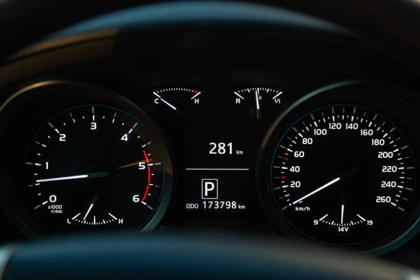 istock Modern car illuminated dashboard closeup. White arrows on Speedometer 1391199927