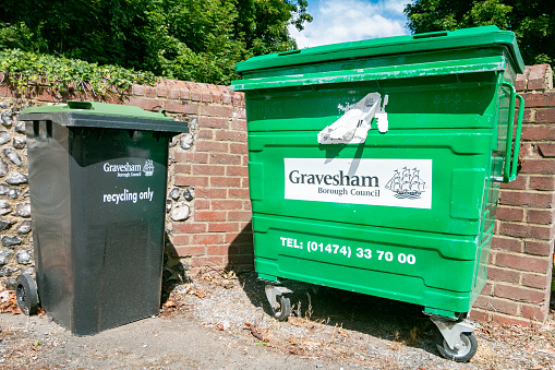 Wheeled Garbage Can of Gravesham Borough Council at Meopham in Kent, England, with a symbol visible.