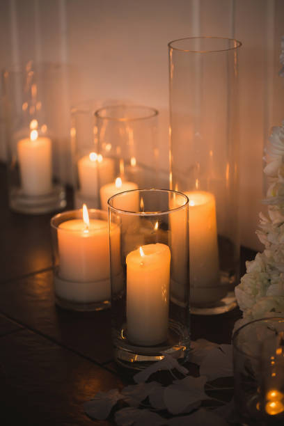 istock vases with candles stand for wedding ceremony. 1391201285
