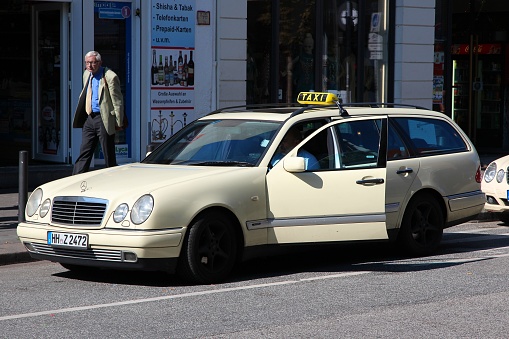 Mercedes-Benz taxi cab parked in Hamburg, Germany.