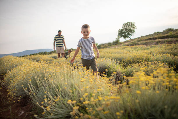 istock Walking in the field with dad 1391204864