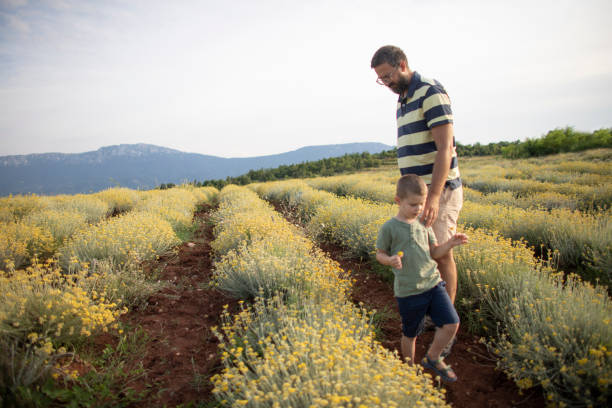 istock Walking in the field with dad 1391204875