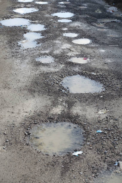 istock rough road, muddy deformed road, rain-destroyed roads, 1391206249