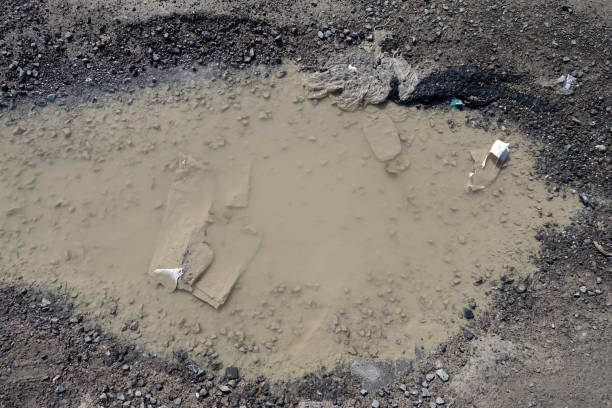 istock rough road, muddy deformed road, rain-destroyed roads, 1391206250