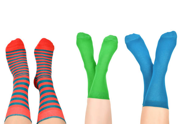 istock Woman in blue socks isolated on white background. Top view. 1391207412