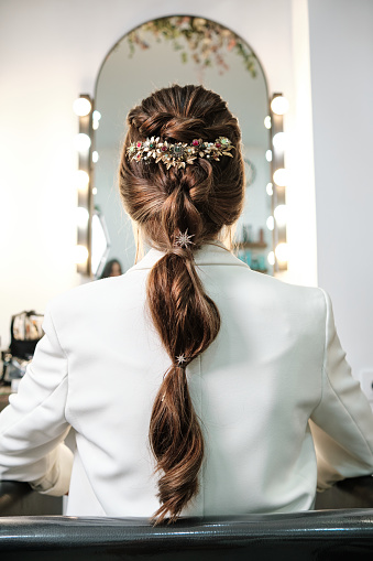 View of a bride hairstyle with a stylish hair accessory. Hairstyle concept.