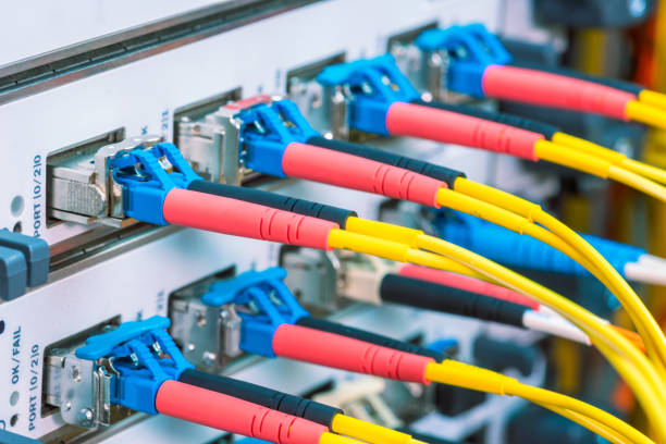 istock High speed optical fiber patch cord cables connected to switch 1391209186
