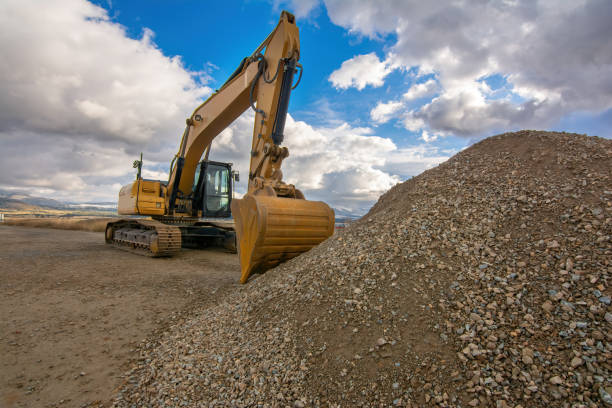 istock Excavator moving dirt and sand at a construction site 1391209331