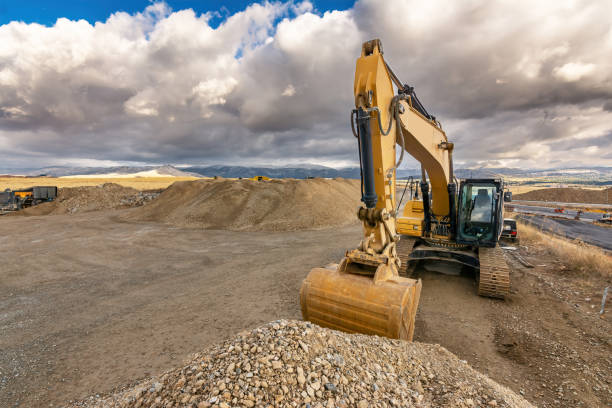 istock Excavator moving dirt and sand at a construction site 1391209335