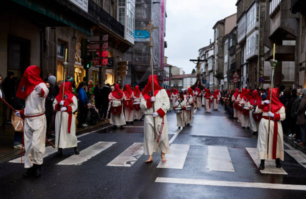 Holy Week Santiago de Compostela, Spain (April 12, 2022).  Is one of the most solemn celebrations in Spain. The Nazarenes or brotherhoods walk the streets hooded with hoods carrying religious images snake hood stock pictures, royalty-free photos & images