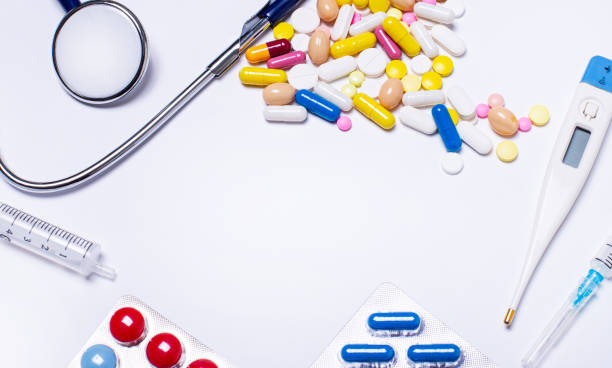 istock On a white background, pills, a stethoscope, a syringe, a thermometer and a place to insert text. Copy space 1391211701